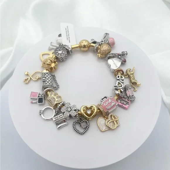 Linx Yellow Gold Bracelet with Gold Silver and Pink Nurse Girlfriend Charms